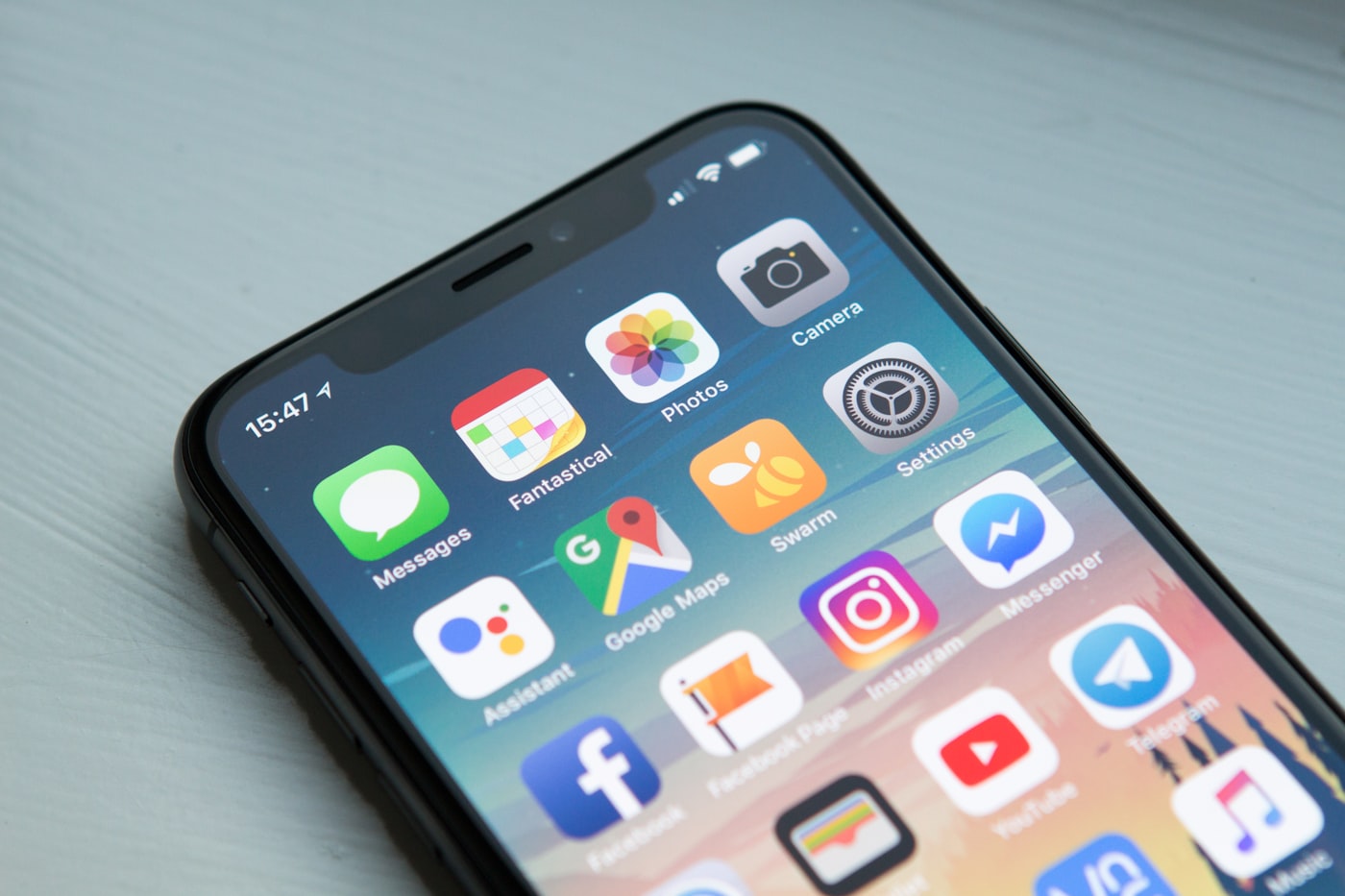 Mobile application development shown on a smartphone
